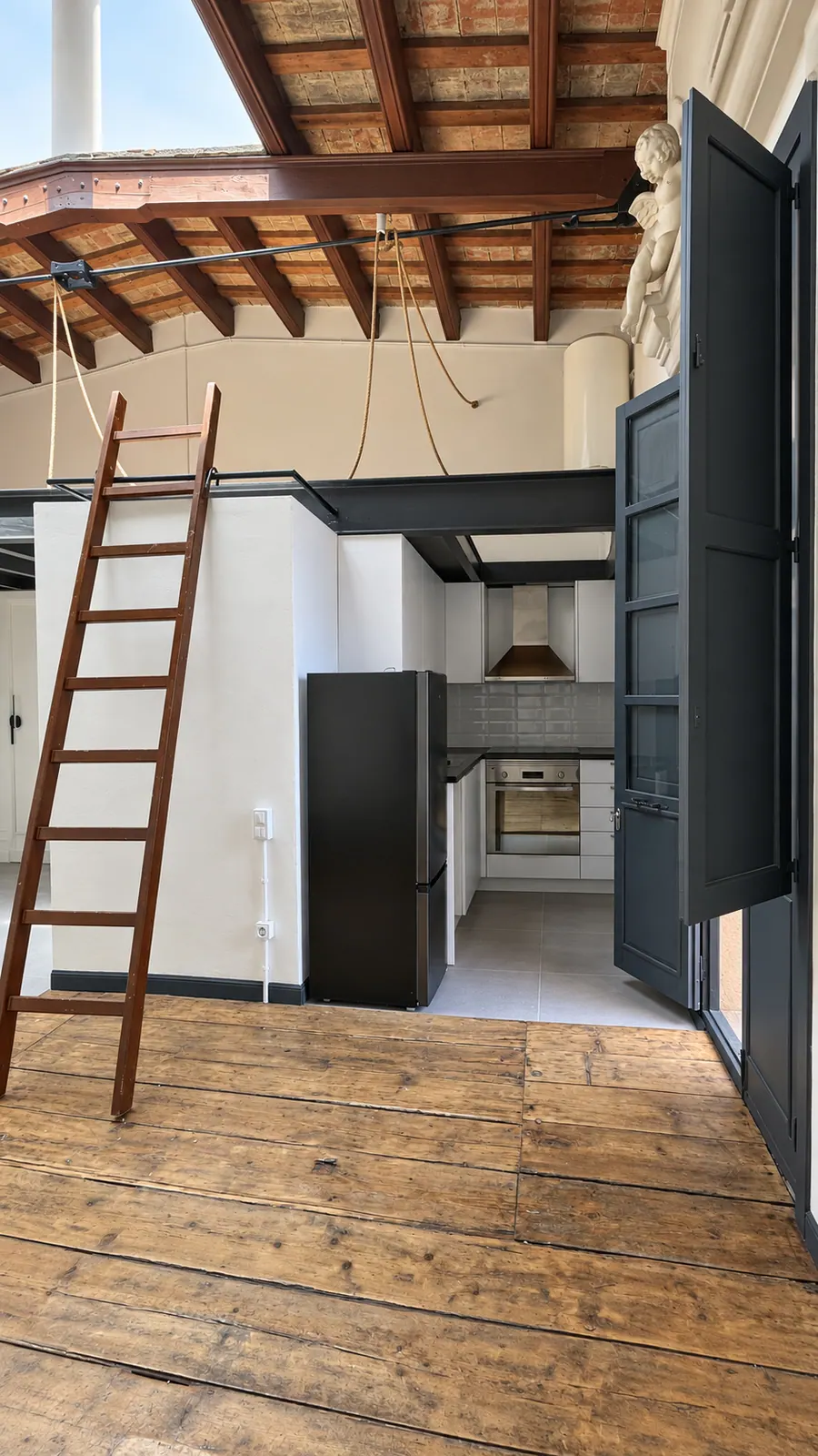 AiP third-floor white kitchen with mezzanine ladder