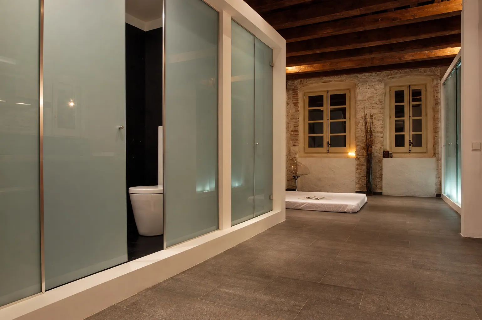 OLi bathroom and sleeping area with frosted glass doors