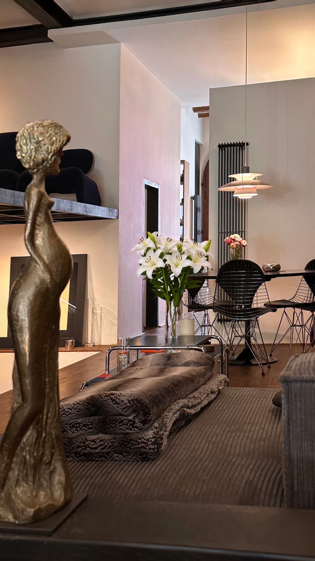 AuL living and dining areas with sculpture