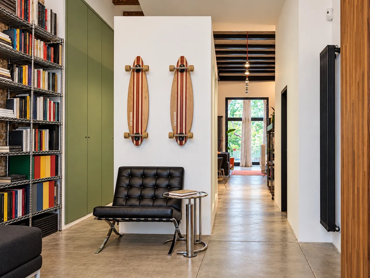 AiP ground floor entrance with bookshelf and leather chair